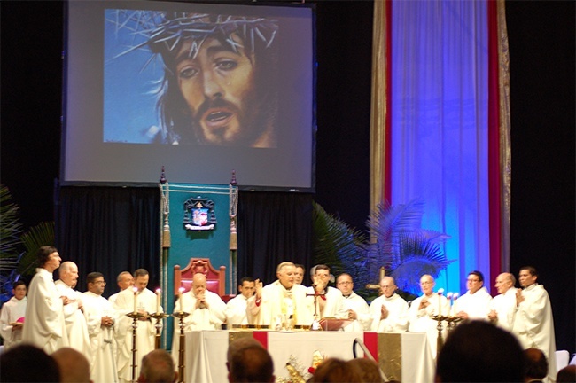 Archbishop  Thomas Wenski presides and more than a dozen priests concelebrate the Mass marking the 50th anniversary of St. Louis Parish.