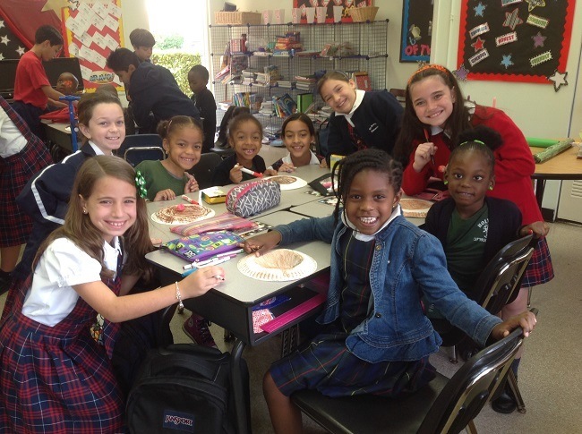 St. Brendan students donated lunch and toys to fellow students at Holy Family School in North Miami.