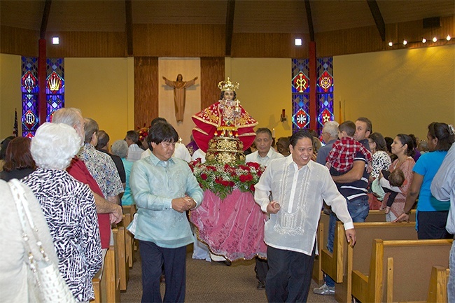 The image of  "El Santo Niño de Cebú" is moved in procession to its final resting place inside St. Bernard Church in Sunrise.