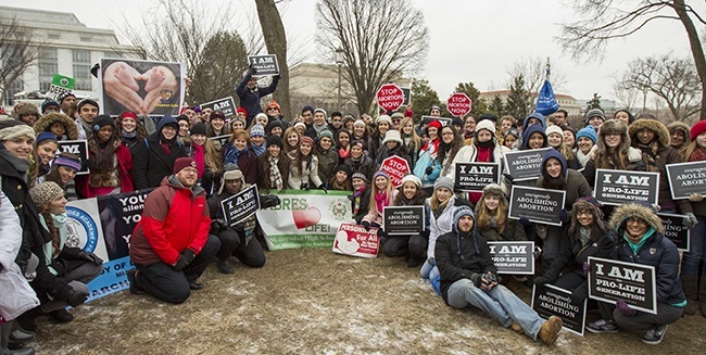 Some of the more than 130 high school students from 11 Catholic schools in the Archdiocese of Miami who went to Washington, D.C., pose for a photo after participating in this year's March for Life. This is the 40th March for Life – which protests abortion – and it is also the 40th anniversary of the U.S. Supreme Court decision legalizing abortion nationwide.