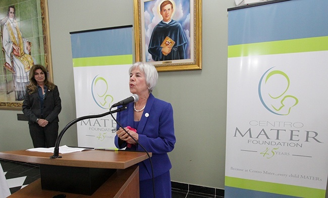 Centro Mater's retiring executive director, Miriam Roman, says a few words at the reception that followed the Mass.