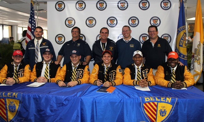The 2013 football signing class from Belen Jesuit pose for a photo with their coaches. Student athletes from left to right: Camilo Padron, Andres Garcia, Cristian Garcia, Mateo Buraglia, Xavier Hines and Keonte Cash.