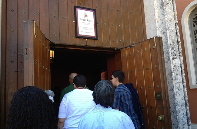 Parents, sponsors and those preparing to receive confirmation and first Communion this year enter St. Mary Cathedral - physically and symbolically - through the door designated as the "holy door" during this Year of Faith.