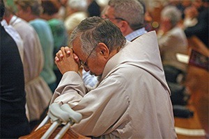 Brother Jay Rivera, founder and superior of the Franciscan Brothers of Life and archdiocesan coordinator of the Respect Life Office's Project Joseph, prays during the Mass.