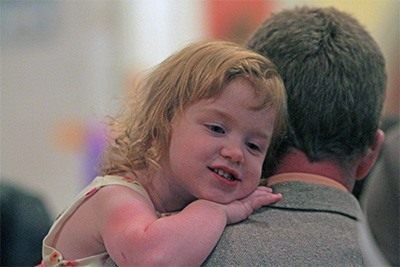 Kate Socia, 3, rests on the shoulder of her father, Alex Socia, a Respect Life lay minister from St. Ambrose Church in Deerfield Beach.