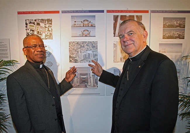 Port-au-Prince Auxiliary Bishop Quesnel Alphonse and Miami Archbishop Thomas Webski point to the winning design for a rebuilt Notre Dame de L'Assomption Cathedral during the opening of the exhibit at Archbishop Curley Notre Dame's Gallery of Art.