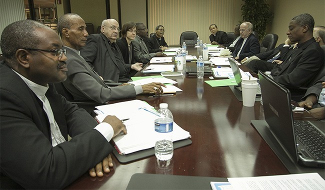 Haitian bishops and priests take part in the discussion during the meeting of PROCHE, the Partnership for the Reconstruction of the Church in Haiti. Second from left is Bishop Pierre-Antoine Paulo of Port-de-Paix, Miami's sister diocese.