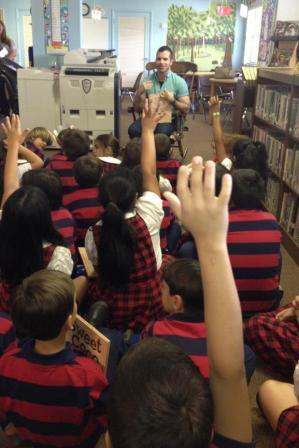 Blessed Trinity alumnus Jake Perez reads from his book, "Sweet Coco," and answers students' questions.