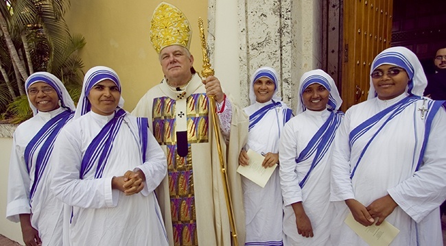 Archbishop Wenski poses with the Missionaries of Charity who run the homeless shelter and soup kitchen in Miami after the Chrism Mass in April 2011.