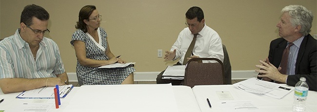 Members of the Synod task force on an archdiocesan pastoral council at their most recent meeting, from left: Homero Cruz, Debbie DeLeon, John Cooper and Patrick McGrath.