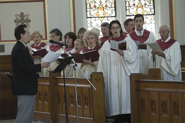 The choir from St. John Neumann Parish, directed by attorney Gregory Sendler, sings at the Red Mass.