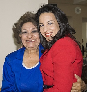 Judge Beatrice Butchko of the 11th Judicial Circuit of Florida is congratulated by her 86-year-old mother, Carmen Cantero, after receiving the 2013 Lex Christi, Lex Amoris award from the Miami Catholic Lawyers Guild.