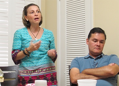 Mineva Padrino and her husband Carlos Pulido make a point during the God in the city presentation at the St. Dimas Center at St. Robert Bellarmine Mission in Miami.