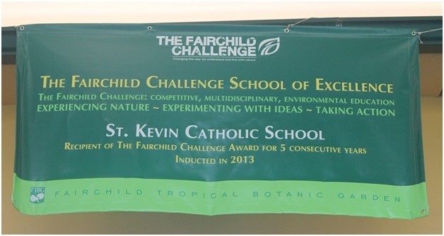 A banner hanging from St. Kevin School announces students' accomplishment of achieving the Fairchild Challenge for five consecutive years.
