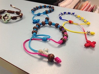 Archbishop Coleman Carroll campus ministry members create these rosary bracelets which they sell on campus to support the Hope for Kasai Project in Congo.