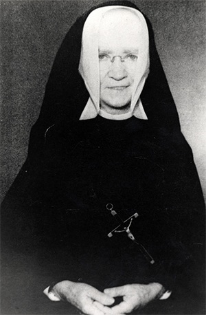 Historical photo of Sister M. Louise Gabriel, of the Sisters of Holy Names of Jesus and Mary, who spearheaded the building of a grotto on the grounds of St. Mary Star of the Sea to protect the island from destructive hurricanes.