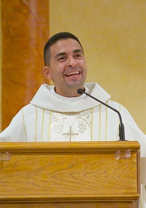 Blessed Trinity administrator Father Jose Alfaro addresses the filled church at the conclusion of the 60th anniversary Mass.
