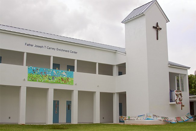 The Father Joseph T. Carney Enrichment Center took several years to complete and now houses the school's Pre-K2 and Pre-K3 classes along with meeting rooms. The cross hanging on the tower was created by the school's art teacher, Natalie Calvo.