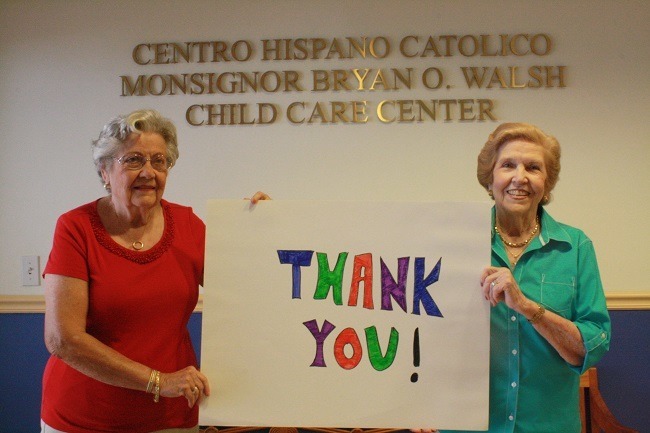 Ladies' auxiliary members Alicia Abreu, left, chair of the building campaign, and Emma McCormack, treasurer, express their thanks to the anonymous individual who paid off the remaining 5,000 building debt for the Centro Hispano Catolico Child Development Center.
The center is located at 125 N.W. 25th Street in the Wynwood section of Miami.