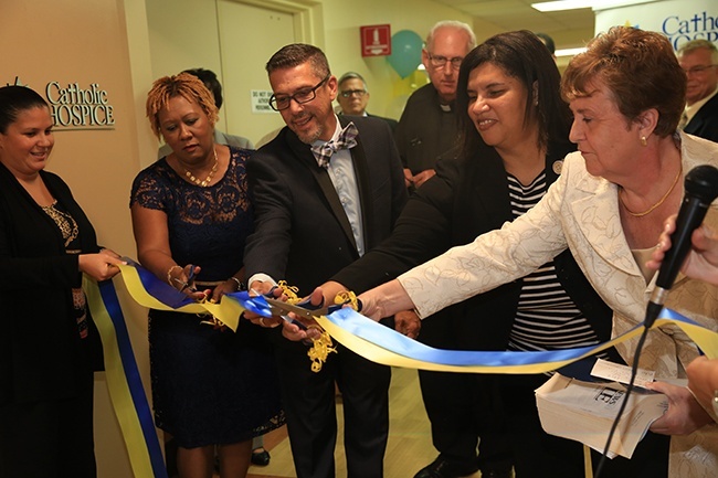 Catholic Hospice staff cut the ribbon to mark the opening of the new inpatient unit at St. Anne's.