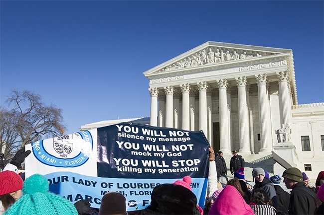 Students from Our Lady of Lourdes Academy in Miami hold up a banner in front of the Supreme Court during the 41 annual March for Life in Washington, D.C.