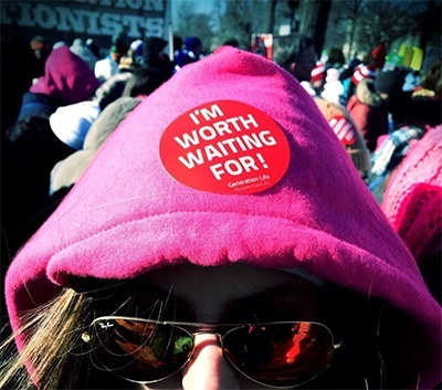 A March for Life participant shares her message with the world via a button on her hoodie.