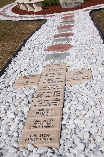 Over 50 engraved pavers make up every bead of the new rosary garden at St. Bernadette Church in Hollywood.