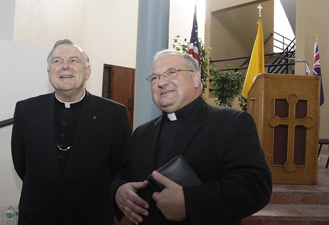 Archbishop Thomas Wenski and Miami's new auxiliary bishop-elect, Msgr. Peter Baldacchino of the Archdiocese of Newark, speak to the media after the official announcement was made.