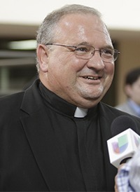 Msgr. Peter Baldacchino, 53, auxiliary bishop-elect of Miami, speaks to local media after his appointment was announced.