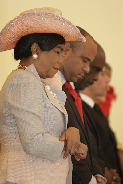 Congresswoman Frederica Wilson and Haitian Prime Minister Laurent Lamothe bow their heads in prayer at the start of the Mass.