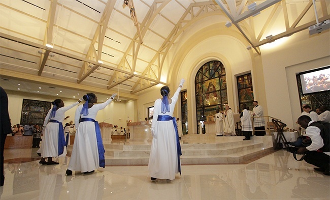 Haitian dancers sway to a gentle beat at the beginning of the Mass to dedicate Notre Dame d'Haiti's new church.