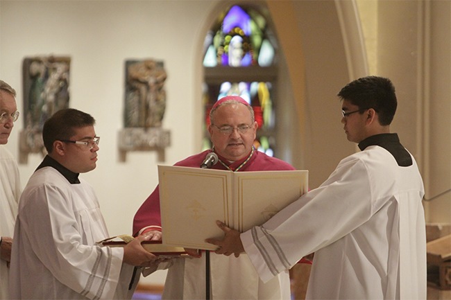 Bishop-elect Peter Baldacchino makes his Profession of Fatih and Oath of Fidelity before Archbishop Thomas Wenski and archdiocesan priests.