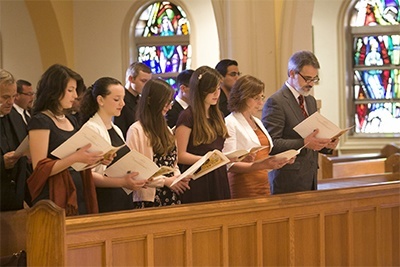 Bishop-elect Peter Baldacchino's family members take part in vespers, from left: Nieces Francesca, Sophie, Daniela and Chiara, sister-in-law Maria, and brother, John.