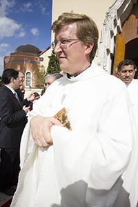 Father Emanuele De Nigris, pastor of St. Cecilia Church in Hialeah, exits the cathedral after the ordination Mass.