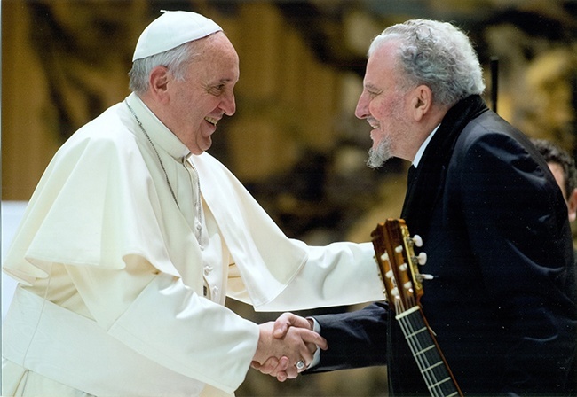 Pope Francis meets with Kiko Arguello, co-founder of the Neocatechumenal Way, during a meeting with more than 10,000 members of the group in the Vatican this past February.