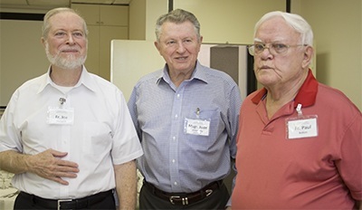 Posing for a photo, from left: Father Joseph Fishwick, retired, Msgr. Jude O'Doherty, luncheon host and Epiphany pastor, and Father Paul Bolton, retired.