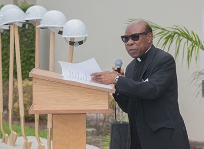 St. Henry pastor, Father Francis Akwue addresses crowd at groundbreaking