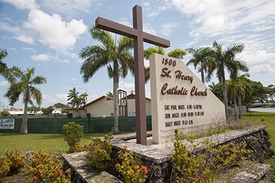 St. Henry Church as seen from North Andrews Avenue with a fence circling the construction area.