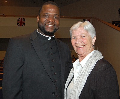 Msgr. Chanel Jeanty, vicar general of the Archdiocese of Miami, at PACT's Nehemiah Action Assembly, with Joan Lyons of Christ the King Parish, co-president of the PACT executive committee.