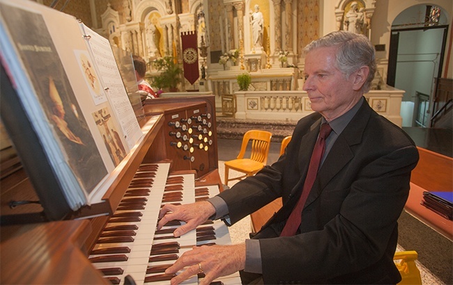 Lex Christi, Lex Amoris 2014 recipient William VanderWyden plays the organ during the Red Mass.