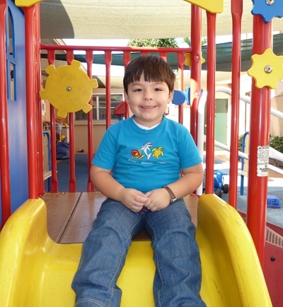 Daniel Valdez, 3 years old, plays in the young children's playground at Centro Mater Little Havana.