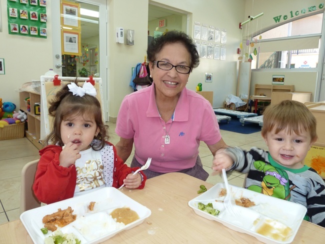 Clara Gesni, caretaker at Centro Mater for 27 years, poses between Leah LLanes and Angelo Falero while at lunchtime.