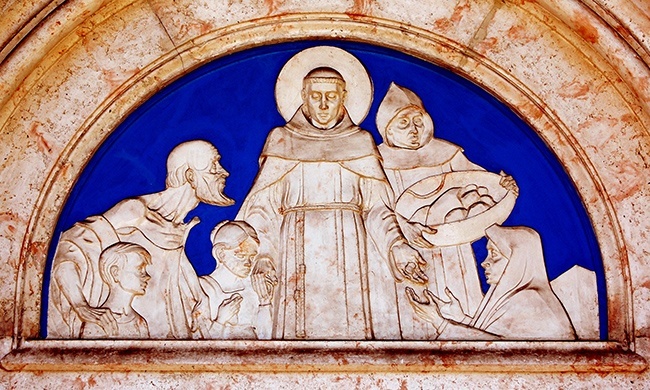 Frieze over the entrance to the church shows St. Anthony feeding the poor.