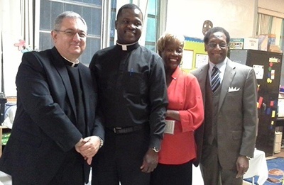 Pictured here with Father Wayne Carroll Paysse, far left, during his May visit to South Florida are Msgr. Chanel Jeanty, vicar general and pastor of St. Philip Neri Parish, Katrinia Reeves-Jackman, director of the Office of Black Catholic Ministry in the archdiocese, and Donnie Edwards, associate superintendent of schools and chair of the education committee of the Office of Black Catholic Ministry.