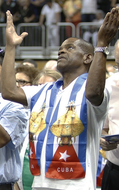 The faithful pray the Our Father during the Mass.