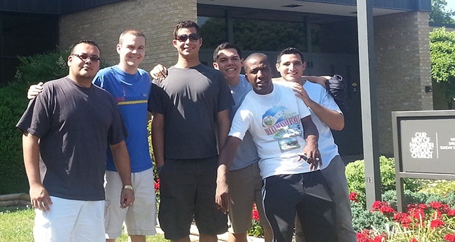 Miami seminarians at Our Lady of Nazareth Church in Roanoke, Va., where they picked up donated items to take and distribute at numerous migrant worker camps throughout the summer. From left: Miami seminarians Andres Pareja, Enzo Rosario, Nick Toledo, Remy Jeudy and Juan Suarez pose with Richmond seminarian Kyle O’Connor (second from left).