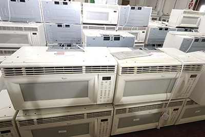 Pictured: Some of the 200 donated microwaves that remain to be distributed to anyone in need.