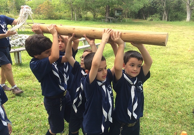 Otters participate in a game involving strength and teamwork during a May campout at Bill Sadowski Park in Palmetto Bay.