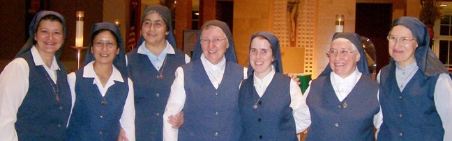 The Daughters of St. Paul currently working in Miami pose with their religious superior after the Mass marking their 50th anniversary in the archdiocese. From left: Sister Marlyn Monge; Sister Margaret Timothy Sato, provincial superior; Sister Teresa Meza, local superior; Sister Majorina Zanatta; Sister Andrew Tyler; Sister Bernadette Fitzgerald; and Sister Stephen Gonzales.